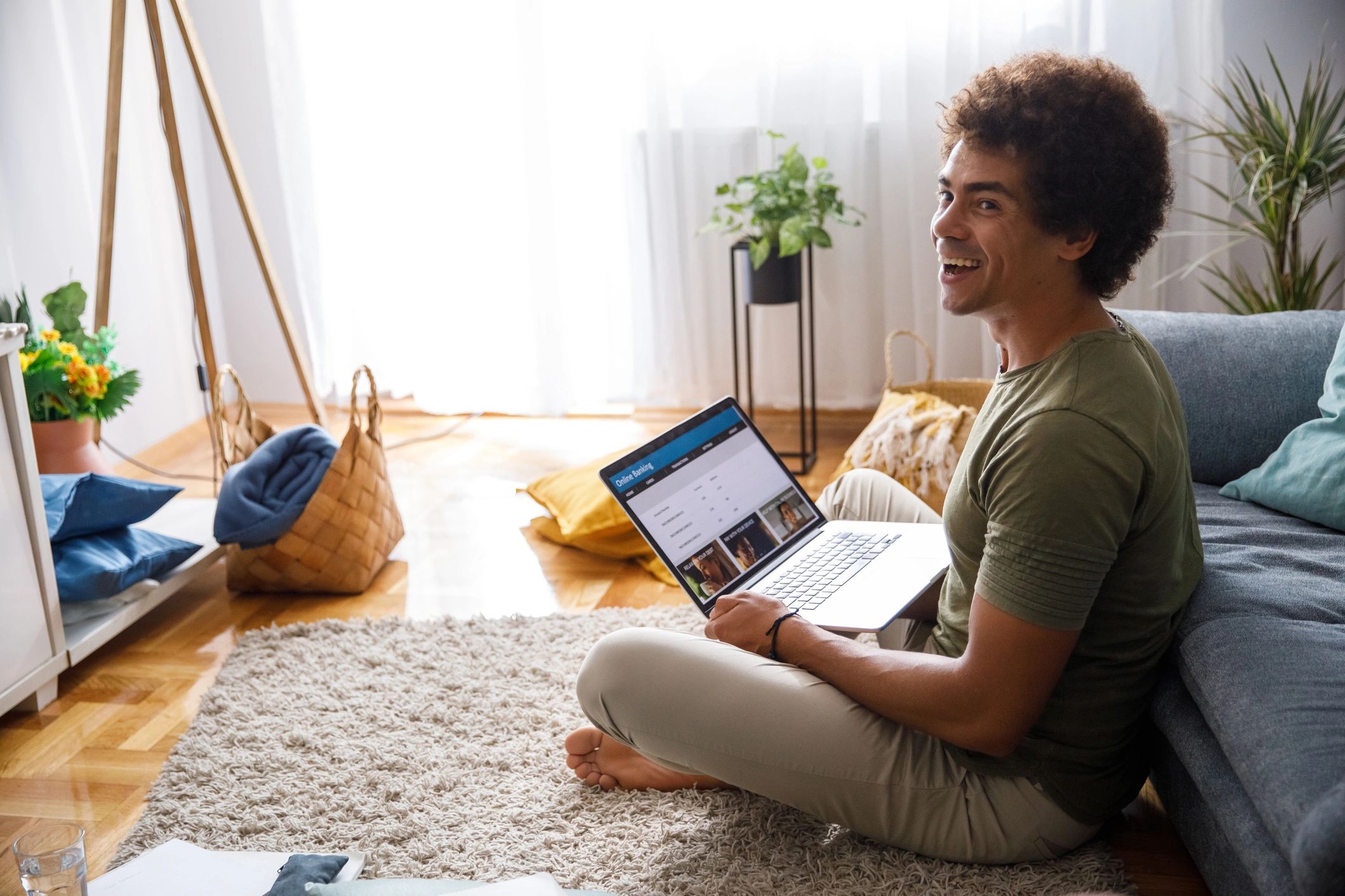 Man shopping online from home on a laptop