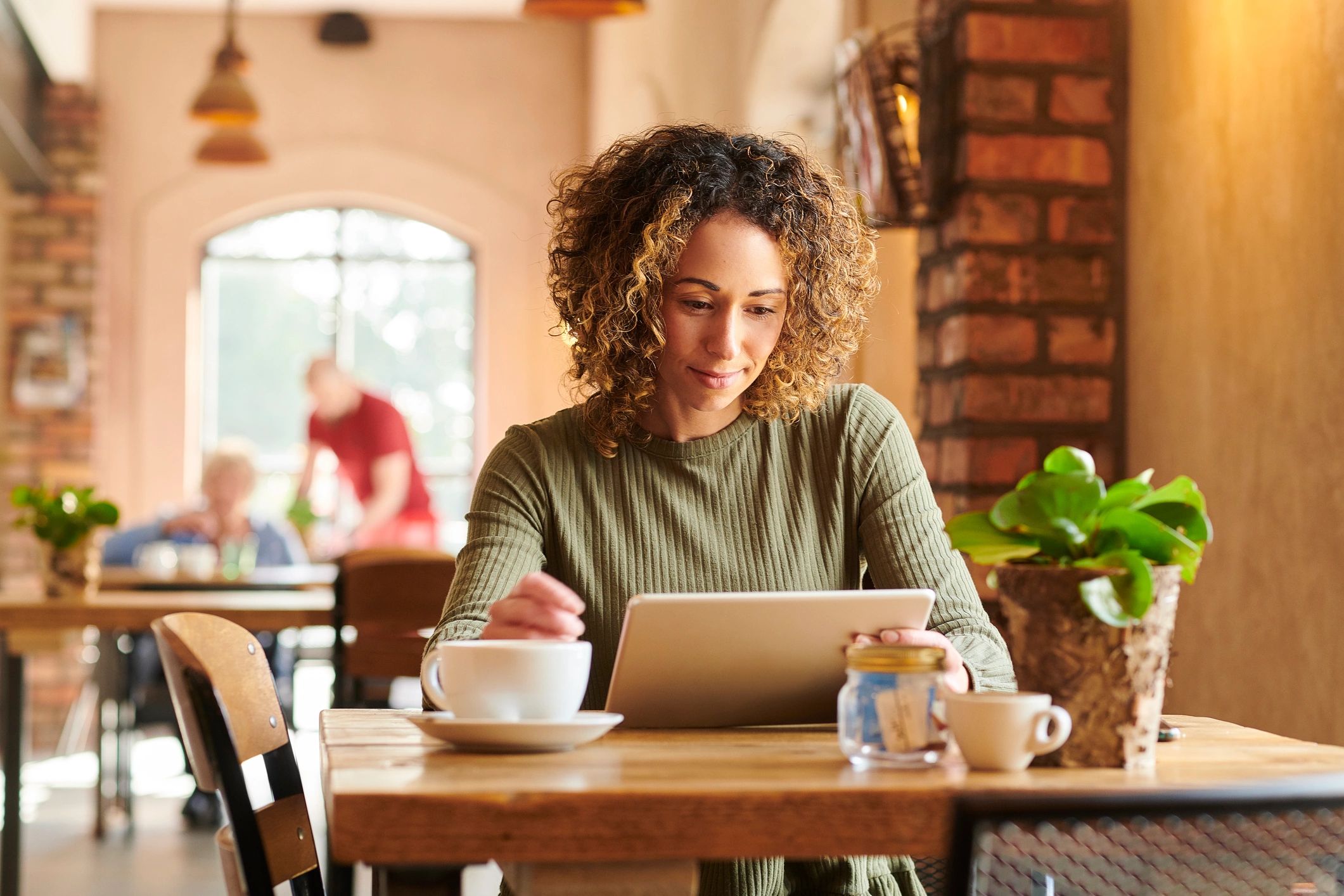 Tablet used for online shopping in a coffee shop